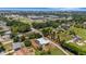 Expansive aerial view of a home with a pool, in a lush neighborhood, and close to city amenities at 1 Brogden Se Ct, Winter Haven, FL 33880