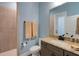 Bathroom with granite countertops and tiled shower at 1 Brogden Se Ct, Winter Haven, FL 33880