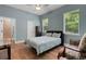 Bedroom with a bed, wood floors, and lots of natural light at 1 Brogden Se Ct, Winter Haven, FL 33880