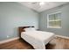 Bedroom featuring wood flooring and window providing natural light at 1 Brogden Se Ct, Winter Haven, FL 33880