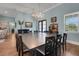 Elegant dining room featuring a large wooden table, chandelier, and access to the foyer and living area at 1 Brogden Se Ct, Winter Haven, FL 33880