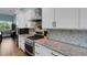 Beautiful gourmet kitchen features stainless steel appliances and white cabinets at 1 Brogden Se Ct, Winter Haven, FL 33880
