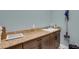 Laundry room with beautiful granite counters, sink, and storage cabinetry providing a clean and functional space at 1 Brogden Se Ct, Winter Haven, FL 33880