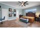 Spacious main bedroom with a decorative bed and bench at 1 Brogden Se Ct, Winter Haven, FL 33880