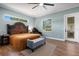 Lovely main bedroom featuring a decorative bed and bench at 1 Brogden Se Ct, Winter Haven, FL 33880