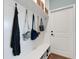 Bright mudroom features storage bench, hooks, and a door to the exterior, creating an organized entryway at 1 Brogden Se Ct, Winter Haven, FL 33880