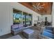 Outdoor patio area with comfortable seating, wood ceiling with fans, and views of the pool at 1 Brogden Se Ct, Winter Haven, FL 33880