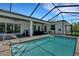 Relaxing pool area with screened lanai, patio furniture, and covered seating for easy outdoor living at 1 Brogden Se Ct, Winter Haven, FL 33880
