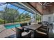 Beautiful outdoor pool with screened enclosure, dining, and hot tub, perfect for enjoying the backyard space at 1 Brogden Se Ct, Winter Haven, FL 33880