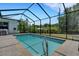 Screened-in pool area with brick pavers and lush landscaping provides a private outdoor retreat at 1 Brogden Se Ct, Winter Haven, FL 33880