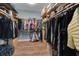 Large walk-in closet with custom wood shelving and plenty of storage at 1 Brogden Se Ct, Winter Haven, FL 33880