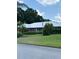 Charming single-story home with a well-manicured lawn and a neatly arranged landscape at 1110 Cypress W Pt, Winter Haven, FL 33884
