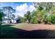 Large backyard with a shed in the distance, showcasing ample space at 1160 Eleanore Ave, Bartow, FL 33830