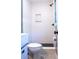 Modern bathroom featuring a step-in shower with textured walls, matte black fixtures, and toilet at 1160 Eleanore Ave, Bartow, FL 33830