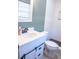 Renovated bathroom showcasing a modern vanity and step-in shower with white textured walls at 1160 Eleanore Ave, Bartow, FL 33830