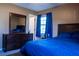 This bedroom has dark wood furniture and soft carpet at 1160 Eleanore Ave, Bartow, FL 33830