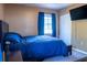 Comfortable bedroom featuring a plush bed, carpeted floors, and a bright window at 1160 Eleanore Ave, Bartow, FL 33830