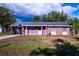 Charming single-story brick home featuring a well-maintained lawn and inviting carport at 1160 Eleanore Ave, Bartow, FL 33830