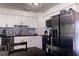 Bright kitchen showcasing white cabinetry, stainless steel appliances, and patterned backsplash at 1160 Eleanore Ave, Bartow, FL 33830