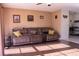 Comfortable living room featuring ample seating, warm lighting, and wood laminate floors at 1160 Eleanore Ave, Bartow, FL 33830