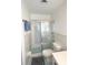 Bathroom with a walk-in shower with sliding glass doors and a tiled floor at 1208 W Lake Buckeye Dr, Winter Haven, FL 33881
