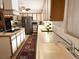 Traditional kitchen with ample cabinet space, stainless steel appliances, and stylish tile backsplash at 1208 W Lake Buckeye Dr, Winter Haven, FL 33881