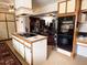 Spacious kitchen with center island cooktop, lots of cabinetry, and an open layout to the living areas at 1208 W Lake Buckeye Dr, Winter Haven, FL 33881