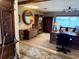Executive office with wooden furniture, large area rug and lake views at 1208 W Lake Buckeye Dr, Winter Haven, FL 33881