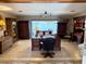 Large home office features custom wood cabinets, desk, and water view from a large window at 1208 W Lake Buckeye Dr, Winter Haven, FL 33881