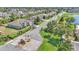Aerial view of a gated community with tree-lined streets and well-maintained landscaping at 1215 Evergreen Park Cir, Lakeland, FL 33813