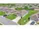 A view of the property, showcasing its manicured lawn and community pool surrounded by trees and a pond at 1215 Evergreen Park Cir, Lakeland, FL 33813