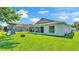 A well-maintained backyard featuring a playset, fire pit, and screened patio for outdoor relaxation at 1215 Evergreen Park Cir, Lakeland, FL 33813