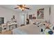Bright bedroom with white furniture, colorful decor, natural light, and ample space at 1215 Evergreen Park Cir, Lakeland, FL 33813