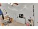 Bright bedroom featuring a ceiling fan, desk, dresser, tv, and ample natural light at 1215 Evergreen Park Cir, Lakeland, FL 33813