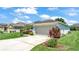 Charming home with a two-car garage, well-manicured landscaping, and inviting curb appeal at 1215 Evergreen Park Cir, Lakeland, FL 33813