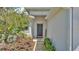 Welcoming front entrance with a decorative wreath, landscaping, and a 'Welcome' sign at 1215 Evergreen Park Cir, Lakeland, FL 33813