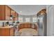 Functional kitchen featuring wooden cabinets and stainless steel appliances at 1215 Evergreen Park Cir, Lakeland, FL 33813