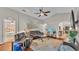 Bright living room featuring hardwood floors, vaulted ceilings, and comfortable leather seating at 1215 Evergreen Park Cir, Lakeland, FL 33813