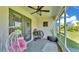 Cozy screened patio with comfortable seating and views of the backyard at 1215 Evergreen Park Cir, Lakeland, FL 33813