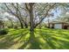 Grassy backyard with mature trees providing ample shade at 1317 Old Polk City Rd, Lakeland, FL 33809