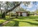 Quaint backyard area with a swing and detached brick garage at 1317 Old Polk City Rd, Lakeland, FL 33809