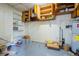 Basement with built-in shelving and water heater at 1317 Old Polk City Rd, Lakeland, FL 33809