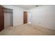 Cozy bedroom with neutral carpet, white walls, and ample closet space, creating a comfortable retreat at 1317 Old Polk City Rd, Lakeland, FL 33809