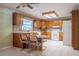 Bright kitchen with wood cabinets, modern appliances, tile flooring, and a cozy dining nook at 1317 Old Polk City Rd, Lakeland, FL 33809