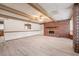 Living room with fireplace and light wood flooring at 1317 Old Polk City Rd, Lakeland, FL 33809