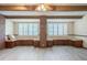Large living room with ceiling fan, a decorative fireplace, and plenty of natural light at 1317 Old Polk City Rd, Lakeland, FL 33809