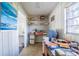 Small office room with built in shelving, a window, and vinyl floors at 1317 Old Polk City Rd, Lakeland, FL 33809
