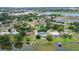 Aerial view of property with pool and lake access at 1328 Edgewater Beach Dr, Lakeland, FL 33805