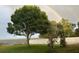 Backyard with lake views featuring a rainbow at 1328 Edgewater Beach Dr, Lakeland, FL 33805