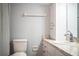 This bathroom features a shower with curtain, wood flooring, granite countertop and ample storage at 1328 Edgewater Beach Dr, Lakeland, FL 33805